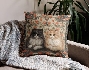 May include: A decorative throw pillow with a floral pattern featuring two cats. The cats are a black and white cat and a brown and white cat. The pillow is made of a soft, comfortable fabric.
