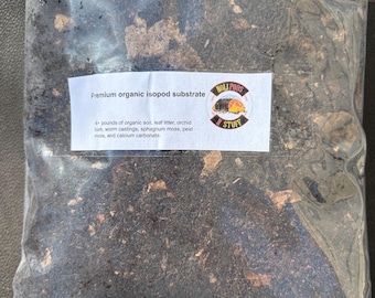 May include: A clear plastic bag filled with a dark brown organic isopod substrate. The bag has a white label that reads "Premium organic isopod substrate" and lists the ingredients: organic soil, leaf litter, orchid bark, worm castings, sphagnum moss, peat moss, and calcium carbonate.