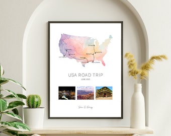 May include: Framed print featuring a watercolor map of the USA with a road trip route marked. The print includes the text "USA ROAD TRIP JUNE 2023" and three small photos. The print is in a black frame.