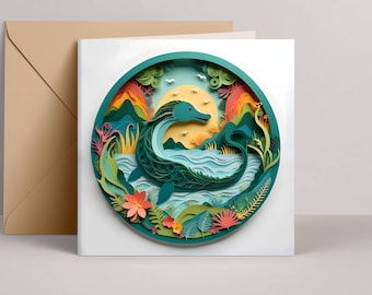 May include: A layered paper art greeting card featuring a teal sea serpent in a circular frame. The design includes a yellow sun, mountains, and colorful flora. A tan envelope is visible to the left.