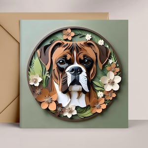 May include: A Boxer dog portrait in a circular frame with paper flowers and greenery. The dog has brown and white fur, with a focused expression. The background is a muted green, and a brown envelope is visible.