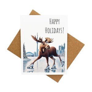 Carte de voeux de Noël avec des orignaux en train de patiner sur le lac Ontario [Légende : Joyeuses Fêtes !] - Livrée avec enveloppe