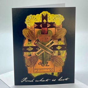 May include: A greeting card with a collage of vintage ticket stubs, a key, and a lace doily. The card has a dark blue background and the text "find what is lost" in white cursive.