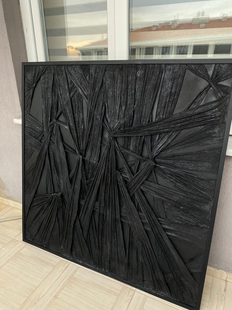 May include: Black and white abstract wall art with a textured, woven design. The art is framed in a black frame.