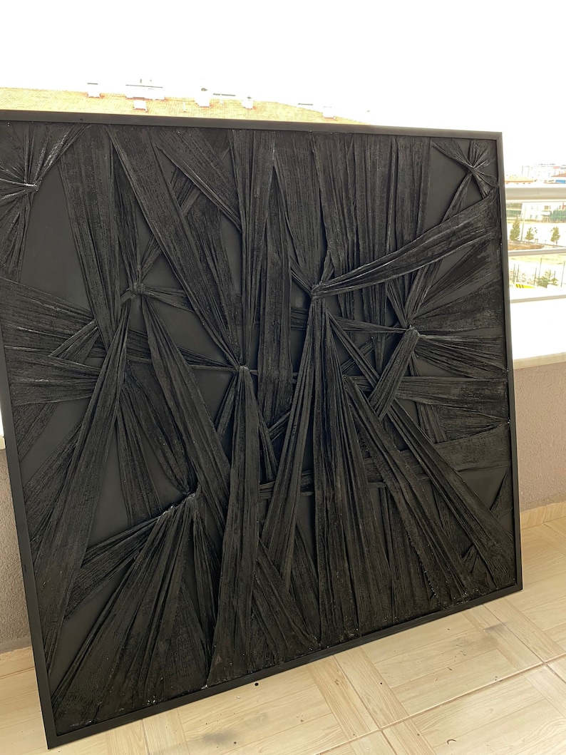 May include: Black and white abstract wall art with a textured, woven design. The art is framed in a black frame.