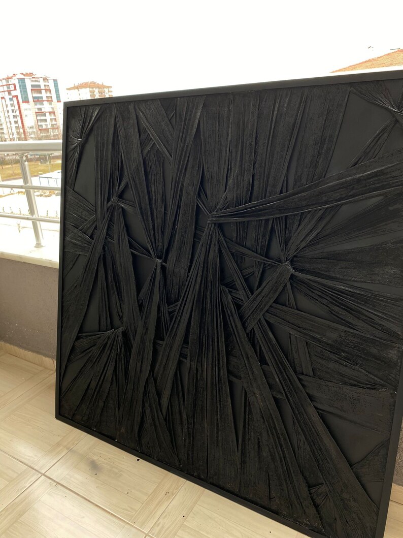 May include: Black and white abstract wall art with a textured, woven design. The art is framed in a black frame.