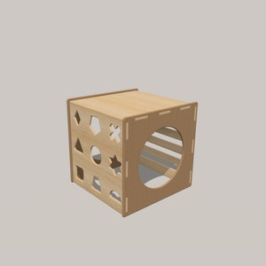 May include: A wooden cube with cut-out shapes on one side and a round opening on another side. The cube is made of light brown wood and has a natural finish.