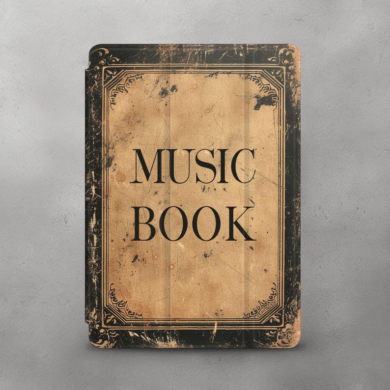 May include: A vintage-style music book cover with a black and gold design. The cover is worn and has a distressed look. The text "MUSIC BOOK" is printed in black on the cover.