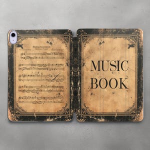May include: A black and gold iPad case with a vintage music book design. The front cover features sheet music with the title "Healing Incantation" and the back cover says "MUSIC BOOK".