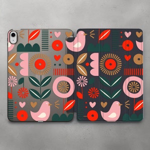 May include: A phone case with a colorful geometric pattern featuring pink birds, red flowers, and green leaves on a gray background.