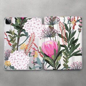 May include: A white case with a floral design featuring pink, red, and yellow flowers. The case is designed for a tablet or phone.