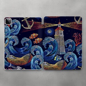 May include: A phone case with an embroidered design of a lighthouse, waves, fish, and anchors. The design is in shades of blue, red, yellow, and white on a dark blue background.
