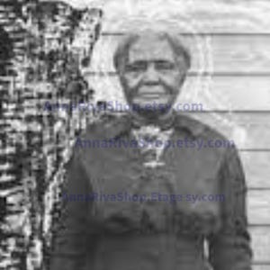 May include: Black and white portrait of an older person with gray hair. The person is wearing a dark colored shirt and is standing in front of a wooden wall.