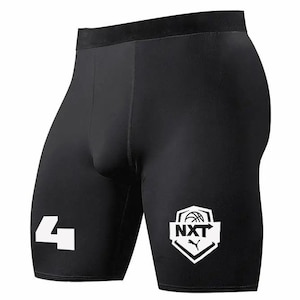 May include: Black athletic shorts with a white number "4" on the left leg and a white logo with the text "NXT" on the right leg.