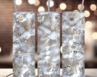 Può includere: Tre bicchieri in acciaio inossidabile con un design floreale bianco e dettagli di glitter argentati. I bicchieri hanno uno sfondo bianco con un motivo di fiori bianchi e glitter argentati.