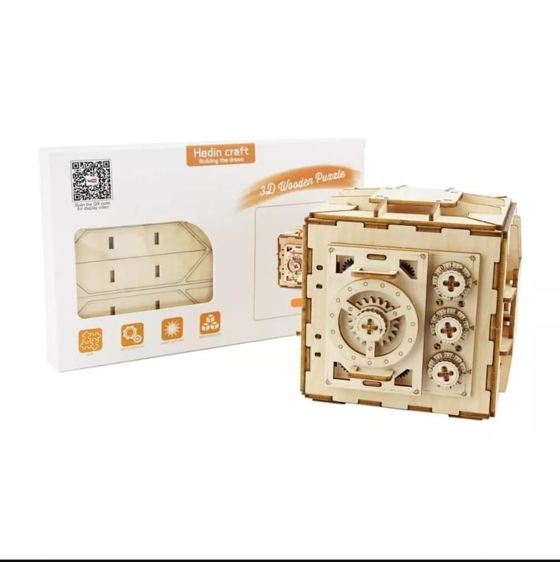 May include: A 3D wooden puzzle of a safe with a working dial and gears. The puzzle is made of natural wood and comes with instructions. The box shows a QR code and the text "Hedin craft Building the dream".