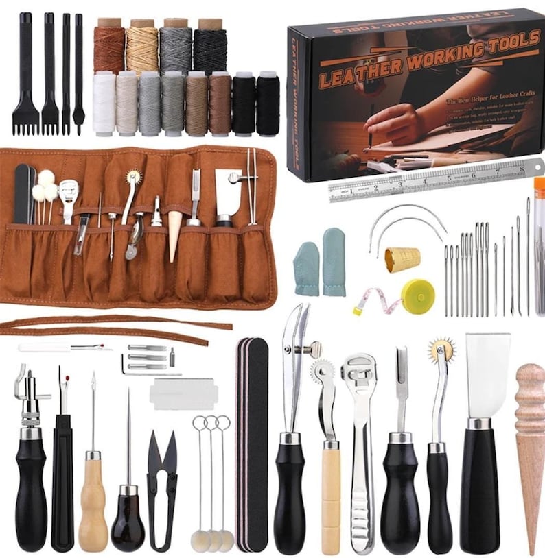 May include: Leather working tools kit with a variety of tools, needles, thread, and a leather roll. The kit includes a leather punch, awl, stitching tools, and more. The kit is packaged in a box with the text "Leather Working Tools" printed on it.