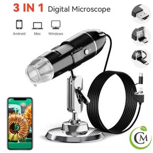 May include: A 3 in 1 digital microscope with a stand, a black and silver body, and a clear lens. The microscope is connected to a computer via a USB cable. The image shows the microscope connected to a smartphone, a laptop, and a desktop computer.