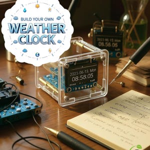 May include: A transparent, cube-shaped weather clock with a digital display showing the date and time. The text "BUILD YOUR OWN WEATHER CLOCK" is displayed above the clock. The clock is surrounded by pens, a notebook, and other electronic components.