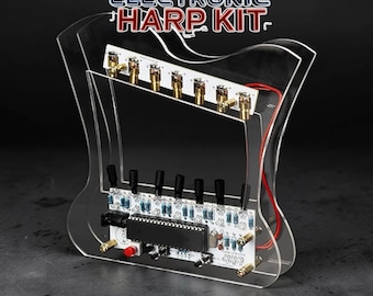 May include: A DIY electronic harp kit with a clear acrylic frame. The kit features circuit boards, knobs, and connectors, with the text "DIY Electronic Harp Kit" and "STEM Gift" in the image.
