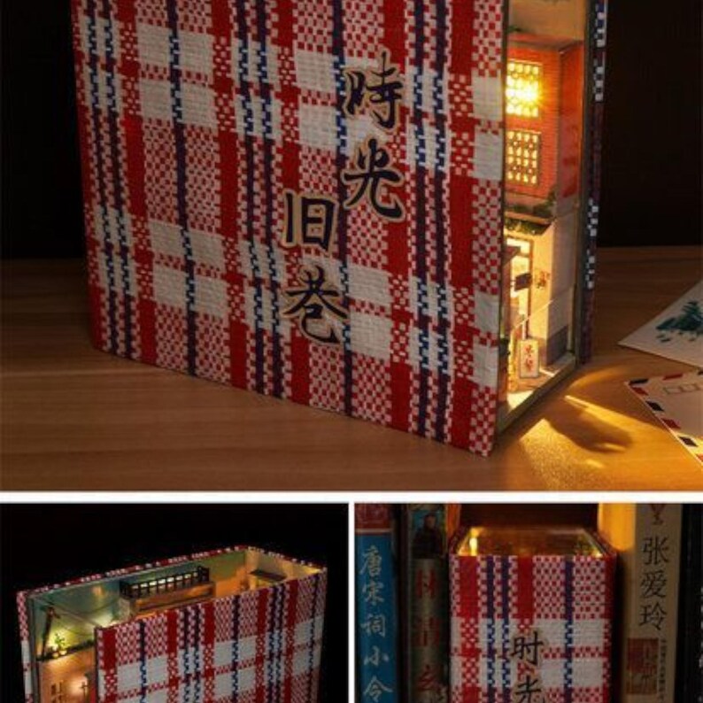 May include: A red and white plaid book with a small, lit building inside. The book has Chinese characters on the cover that read "时光旧梦".