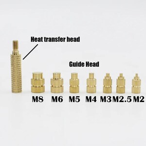 May include: A set of eight gold-colored metal heat transfer heads in various sizes, labeled M8, M6, M5, M4, M3, M2.5, and M2. The largest head is labeled "Heat transfer head" and the smaller heads are labeled "Guide Head".