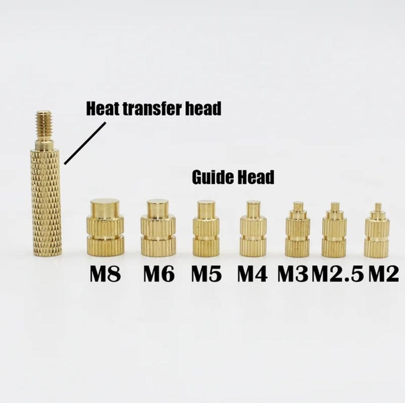 May include: A set of eight gold-colored metal heat transfer heads in various sizes, labeled M8, M6, M5, M4, M3, M2.5, and M2. The largest head is labeled "Heat transfer head" and the smaller heads are labeled "Guide Head".