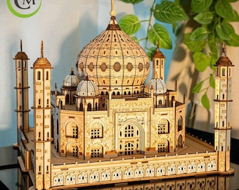 May include: A detailed wooden model of the Taj Mahal, a famous ivory-white marble mausoleum complex in Agra, India. The model features intricate details, including the central dome, minarets, and surrounding gardens.