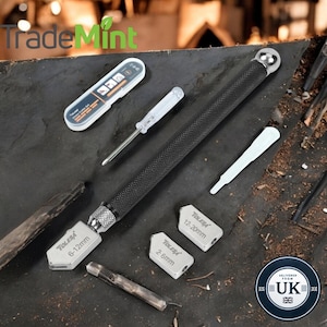 May include: A glass cutter tool set with a black handle and silver blades. The blades are labeled with different sizes: 6-12mm, 2.6mm, and 12.20mm. The set also includes a small screwdriver and a white plastic tool.