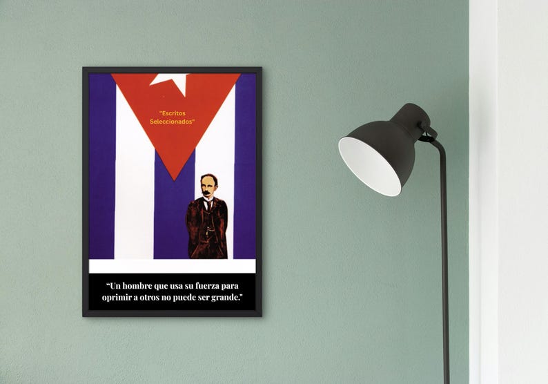 May include: Framed poster featuring the Cuban flag design with a red triangle and white star. The poster includes a portrait of a man and text in Spanish: "Escritos Seleccionados" and a quote. The poster is displayed on a green wall.