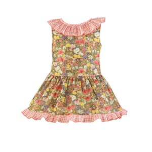 May include: A sleeveless floral dress with a frilled neckline and hem. The dress has a pattern of colourful flowers on a green background. The neckline and hem are trimmed with pink and white gingham fabric.