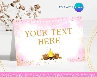 May include: Printable pink and gold place cards or food tent cards with a campfire and drums design. The text "YOUR TEXT HERE" is in gold lettering.  The text "EDIT & DOWNLOAD NOW" is in black lettering.  The text "REBECCA DESIGNS CO." is in black lettering.