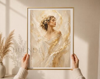 Puede incluir: Una impresión artística enmarcada que presenta a una mujer con un vestido blanco fluido, con un efecto de halo dorado. La obra de arte tiene un estilo suave y pictórico con tonos cálidos y neutros. La impresión está sostenida por manos con un suéter color crema.