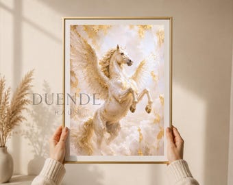 Puede incluir: Impresión enmarcada que presenta un caballo Pegaso blanco con grandes alas, sobre un fondo de nubes doradas. La obra de arte tiene un estilo suave y pictórico, con el texto "DUENDE HAUS" en la esquina inferior izquierda.