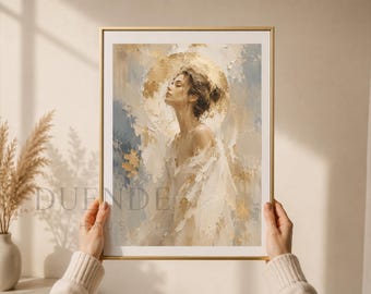 Puede incluir: Una impresión artística enmarcada que presenta una pintura abstracta de una mujer con los ojos cerrados. La obra de arte utiliza una paleta de tonos dorados, blancos y azules. La impresión está sostenida por una persona que lleva un jersey color crema. El texto "DUENDE HAUS" es visible.