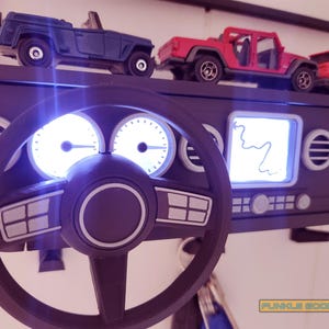 Show off your Jeep style with this fun and functional Duck Duck Jeep Display!

It holds 4 vending machine rubber ducks or 3 Hot Wheels cars, features a light-up front dash for extra flair, hidden storage for sunglasses or other small items, and 3 removable key hooks. Mount it on the wall or set it on a dresser or shelf—either way, it’s the perfect gift for Jeep lovers, Hot Wheels collectors, and ducking enthusiasts who want to organize in style!