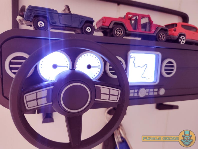 Show off your Jeep style with this fun and functional Duck Duck Jeep Display!

It holds 4 vending machine rubber ducks or 3 Hot Wheels cars, features a light-up front dash for extra flair, hidden storage for sunglasses or other small items, and 3 removable key hooks. Mount it on the wall or set it on a dresser or shelf—either way, it’s the perfect gift for Jeep lovers, Hot Wheels collectors, and ducking enthusiasts who want to organize in style!
