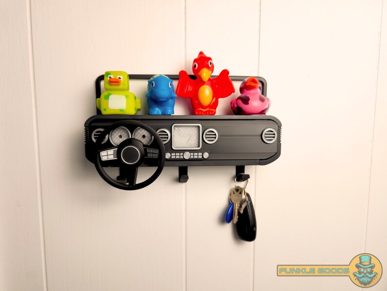 Show off your Jeep style with this fun and functional Duck Duck Jeep Display!

It holds 4 vending machine rubber ducks or 3 Hot Wheels cars, features a light-up front dash for extra flair, hidden storage for sunglasses or other small items, and 3 removable key hooks. Mount it on the wall or set it on a dresser or shelf—either way, it’s the perfect gift for Jeep lovers, Hot Wheels collectors, and ducking enthusiasts who want to organize in style!