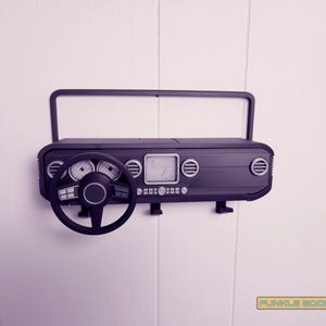 Show off your Jeep style with this fun and functional Duck Duck Jeep Display!

It holds 4 vending machine rubber ducks or 3 Hot Wheels cars, features a light-up front dash for extra flair, hidden storage for sunglasses or other small items, and 3 removable key hooks. Mount it on the wall or set it on a dresser or shelf—either way, it’s the perfect gift for Jeep lovers, Hot Wheels collectors, and ducking enthusiasts who want to organize in style!
