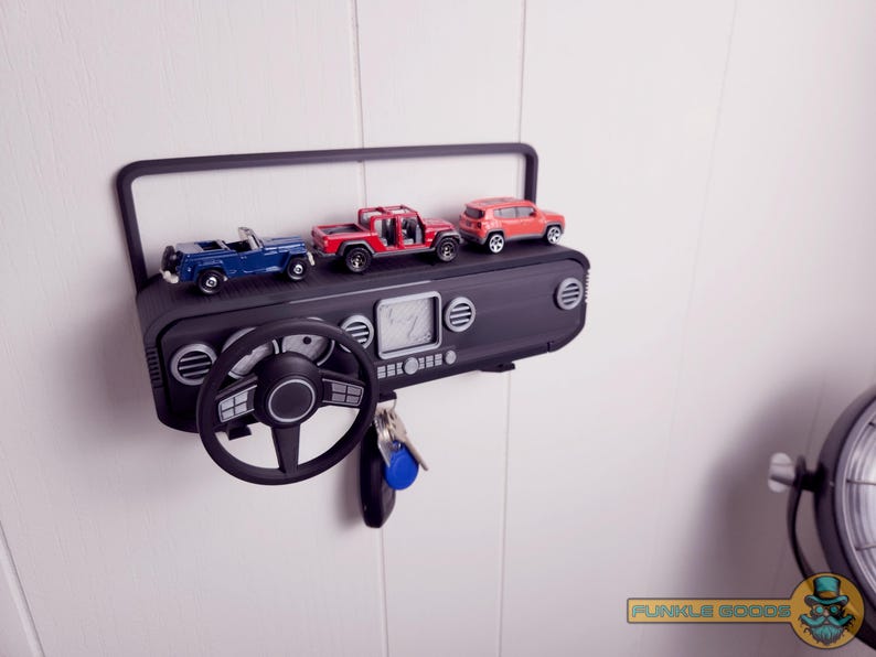 Show off your Jeep style with this fun and functional Duck Duck Jeep Display!

It holds 4 vending machine rubber ducks or 3 Hot Wheels cars, features a light-up front dash for extra flair, hidden storage for sunglasses or other small items, and 3 removable key hooks. Mount it on the wall or set it on a dresser or shelf—either way, it’s the perfect gift for Jeep lovers, Hot Wheels collectors, and ducking enthusiasts who want to organize in style!