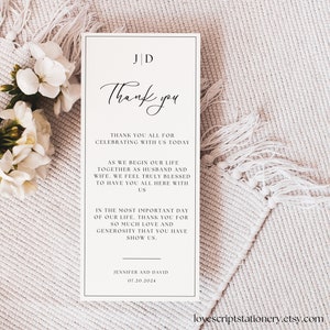 May include: A white thank you card with black text. The text reads "Thank you" in cursive, followed by a message thanking guests for celebrating the couple's wedding. The card also includes the couple's initials, "J D", and the date of the wedding, "07.20.2024".