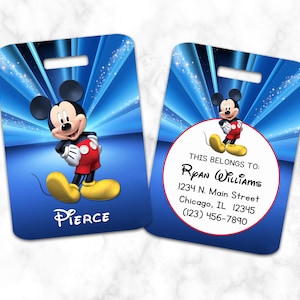 May include: Blue luggage tag with a cartoon image of Mickey Mouse. The tag has a white circle with the text "THIS BELONGS TO:" and a space for a name, address, and phone number.