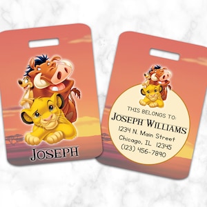 May include: A luggage tag featuring a cartoon image of Simba, Pumbaa, and Timon from Disney's The Lion King. The tag is orange and has a white circle with the text "THIS BELONGS TO: JOSEPH WILLIAMS 1234 N. Main Street Chicago, IL 12345 (123) 456-7890".