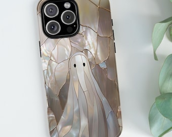 May include: A smartphone case featuring a mosaic-style design with a ghost illustration. The case has a pearlescent, iridescent finish with a light brown and white color palette. The ghost has a simple, minimalist design.