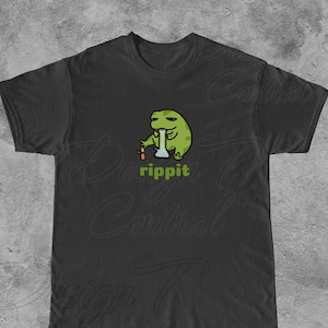 May include: Black t-shirt with a green cartoon frog smoking a bong. The text "rippit" is printed below the frog.