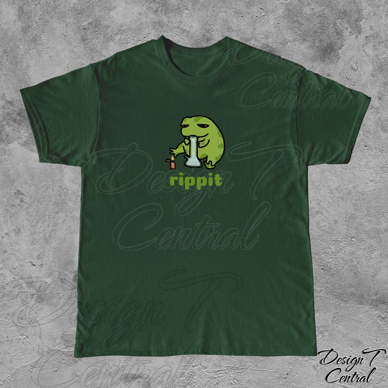 May include: A dark green t-shirt with a cartoon frog smoking a bong. The frog is green and has a relaxed expression. The text "rippit" is printed below the frog.