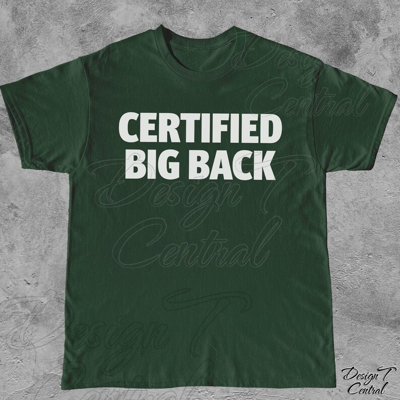 May include: A dark green t-shirt featuring the white text "CERTIFIED BIG BACK" across the chest. The shirt has a crew neck and is likely made from a comfortable fabric. The design is simple and bold.