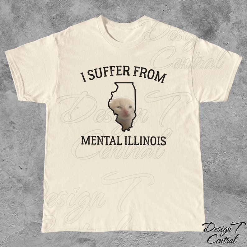 May include: A white t-shirt with black text that reads "I suffer from mental Illinois". The text is centered on the shirt. The state of Illinois is outlined in black and a cat's face is inside the outline.