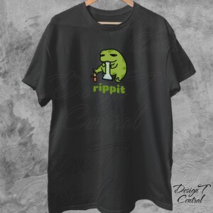 May include: Black t-shirt with a green cartoon frog smoking a bong. The text "rippit" is printed below the frog.