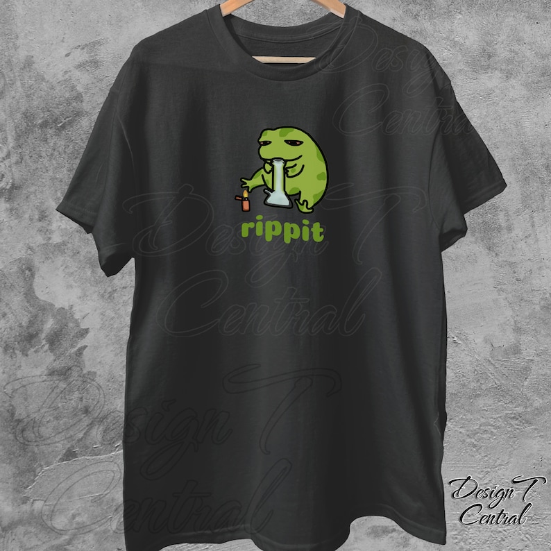 May include: Black t-shirt with a green cartoon frog smoking a bong. The text "rippit" is printed below the frog.